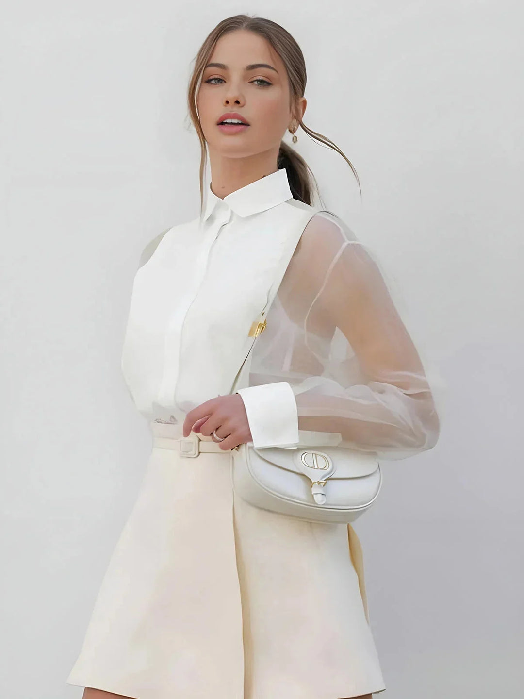 White shift dress with sheer sleeves, perfect for a classic yet elegant look. Made from breathable fabric for comfort all…
